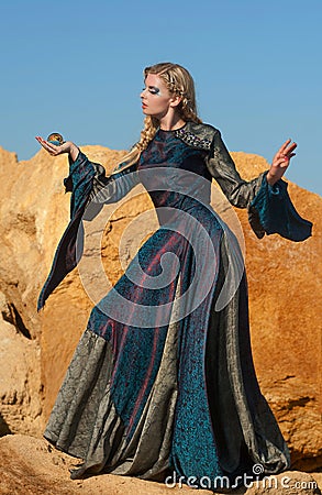 Fairy-tale â€“ the sorceress with magic sphere Stock Photo